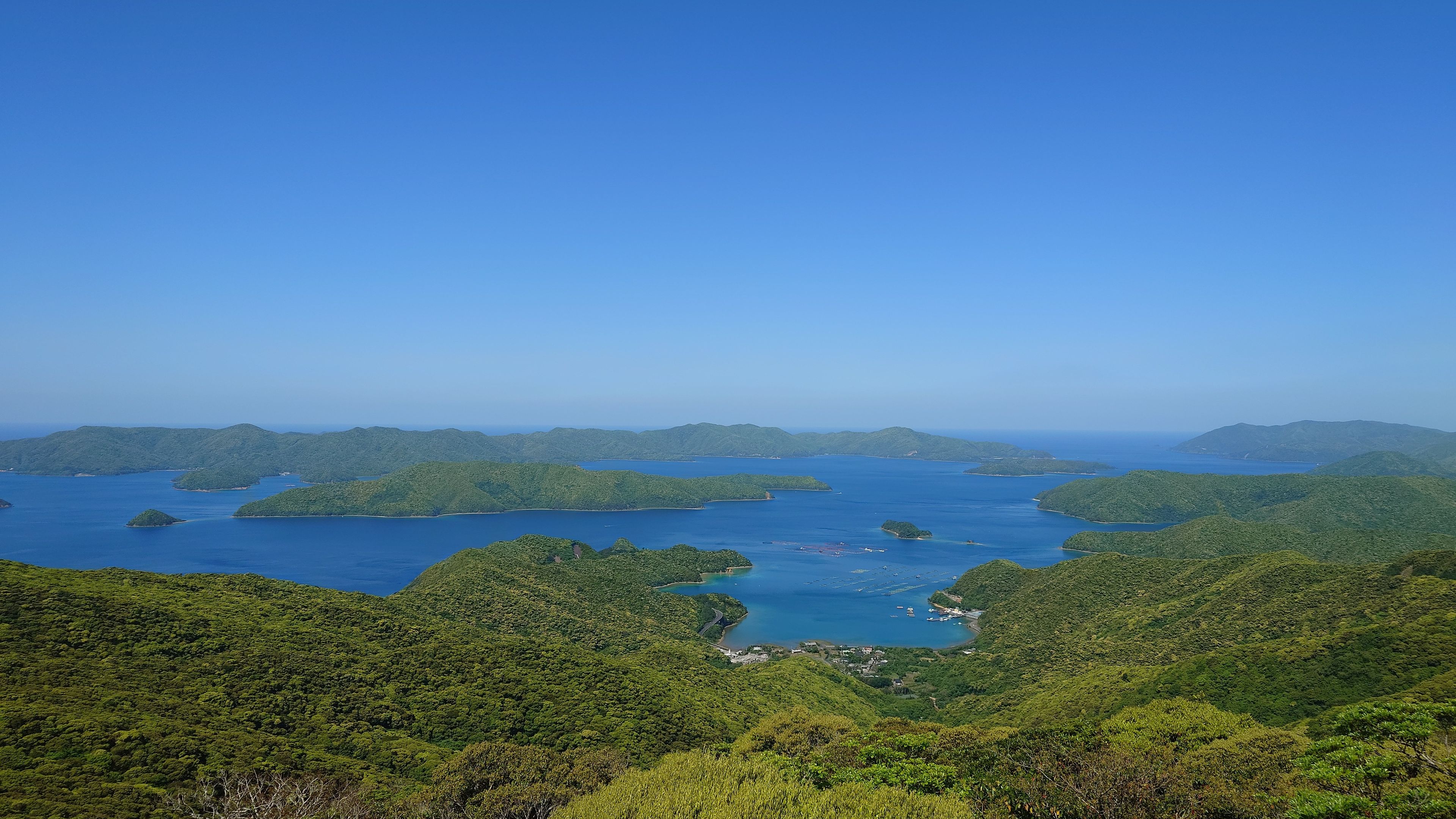 View from Kochi-yama Viewpoint overlooking the subtropical evergreen broadleaf forest and Kakeroma Island