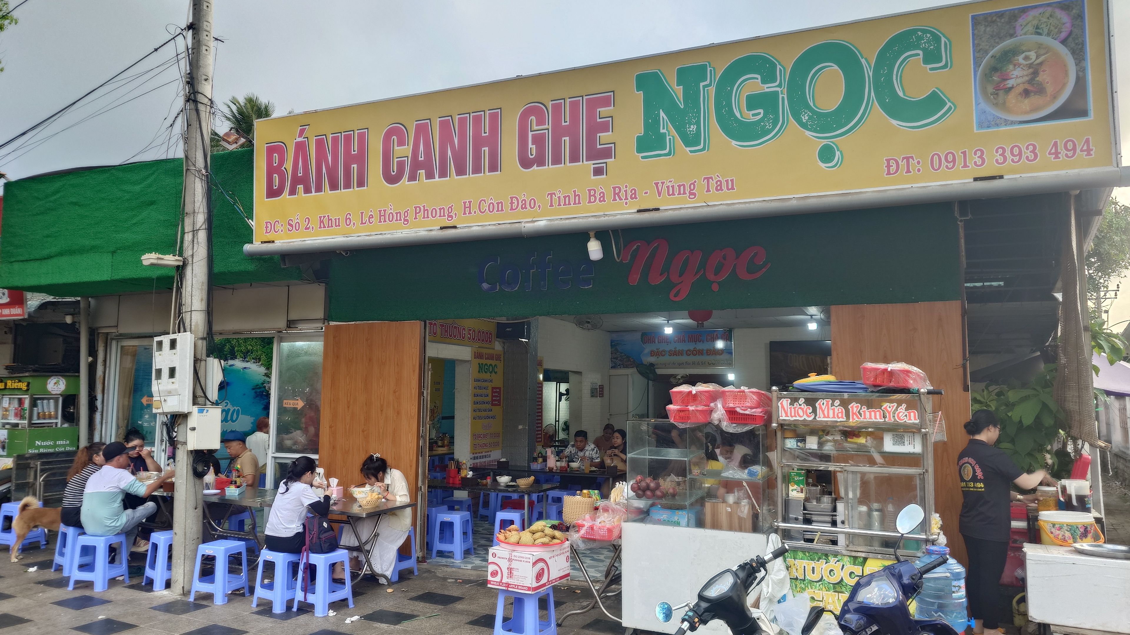 The restaurant's exterior, bustling with locals