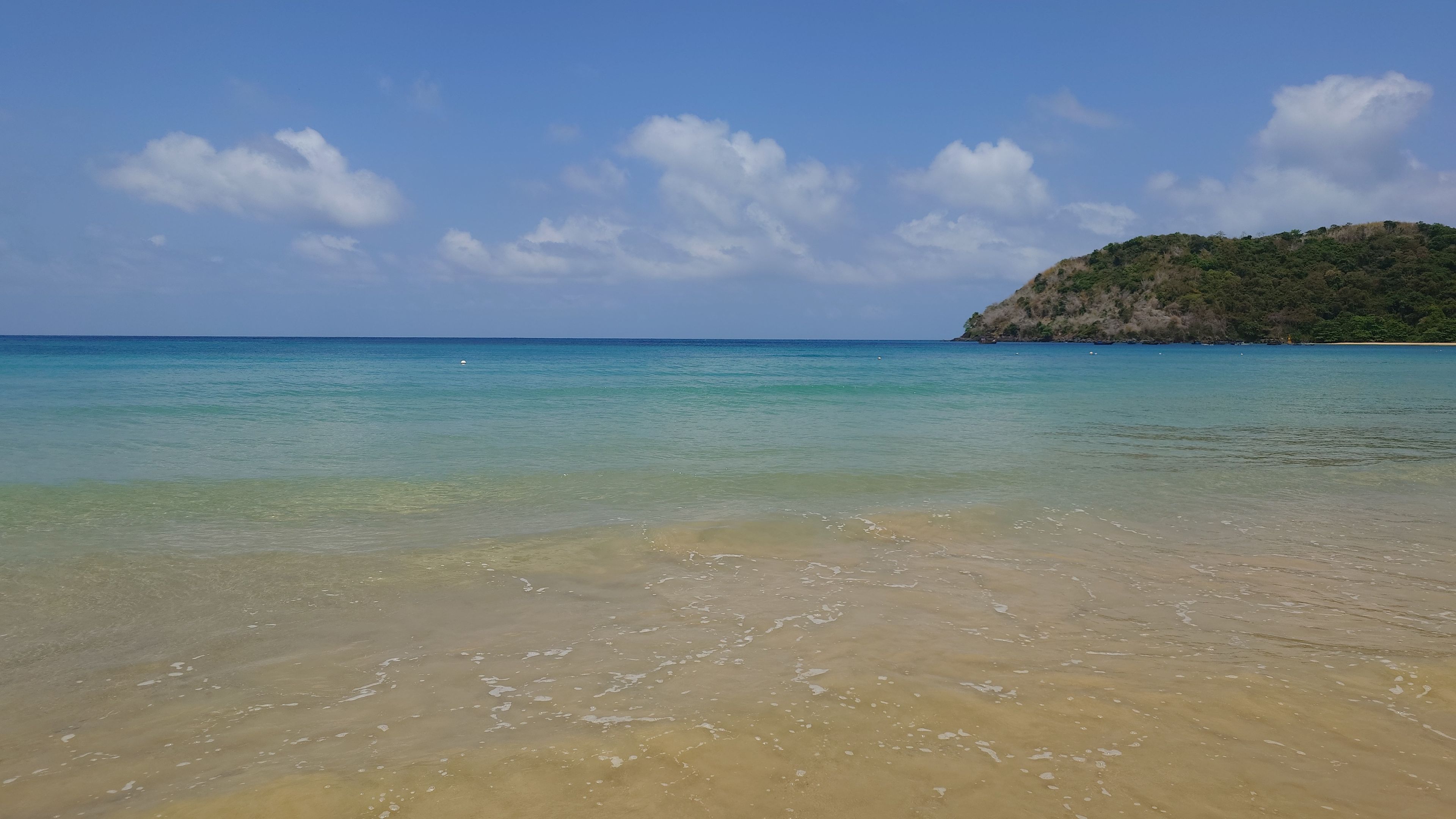 A peaceful scene of Dam Trau Beach with many shaded spots