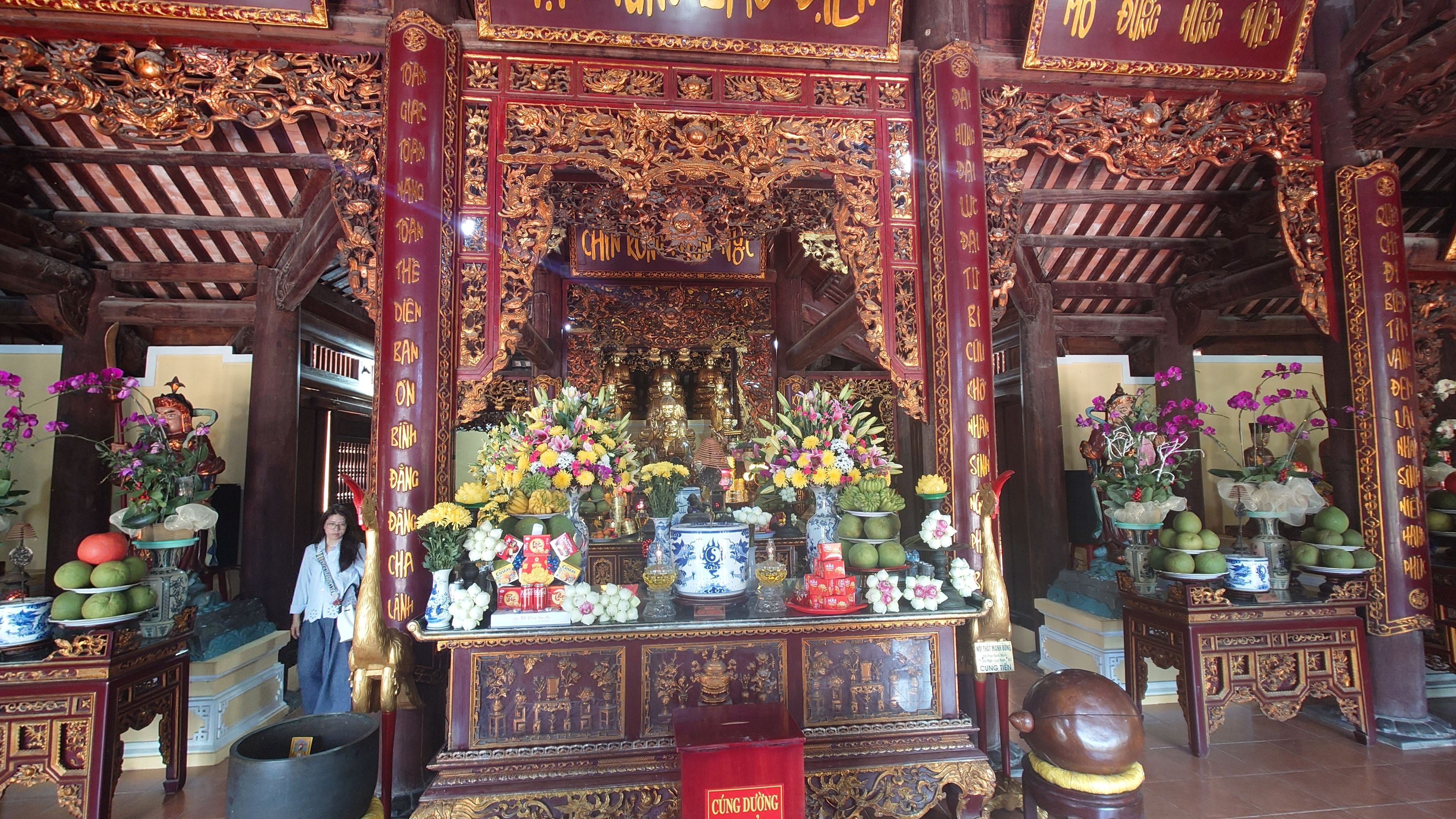 Local worshippers praying fervently inside the main hall