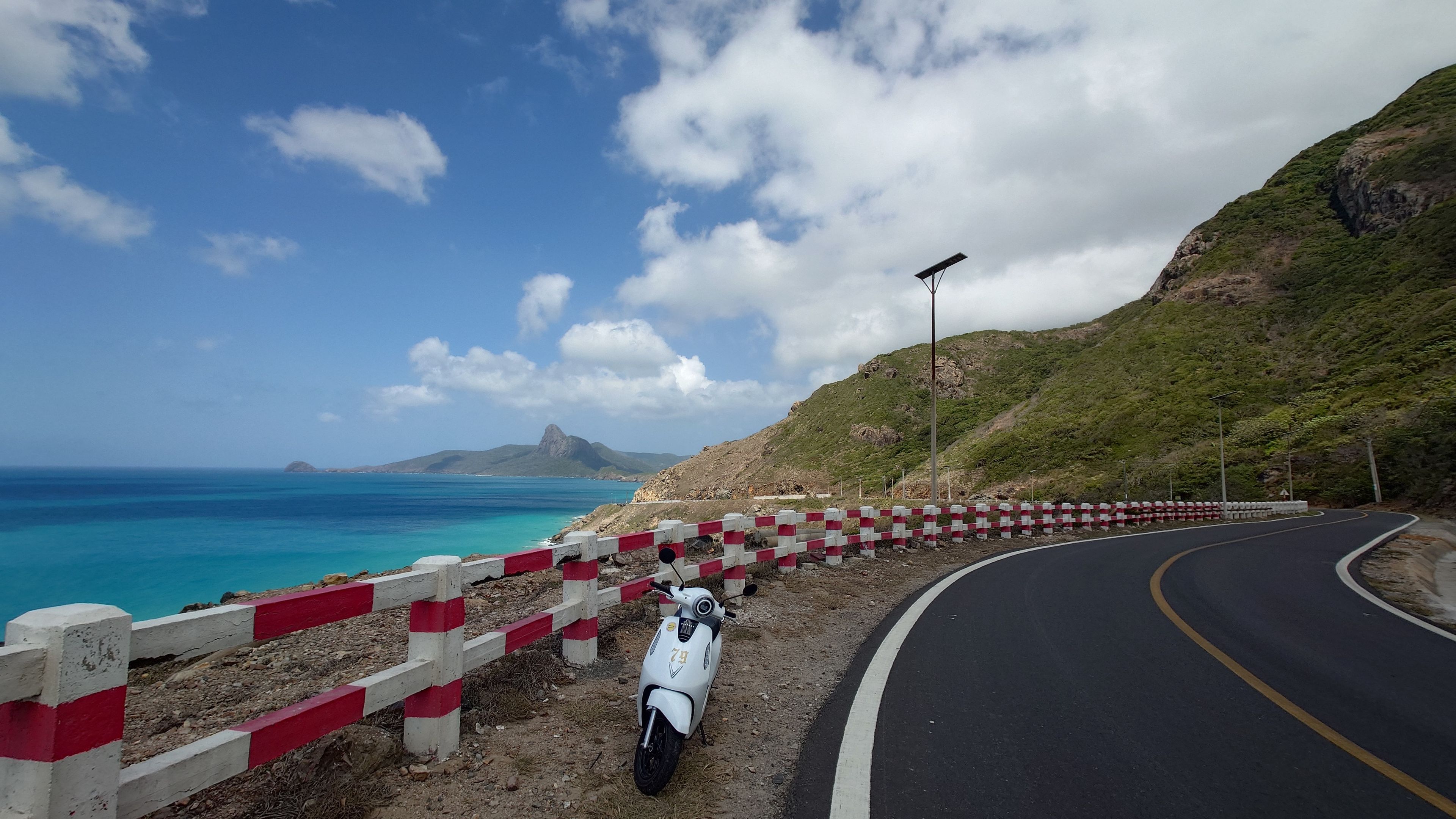 Riding through Con Dao's beautiful coastline by motorbike, the island's best activity