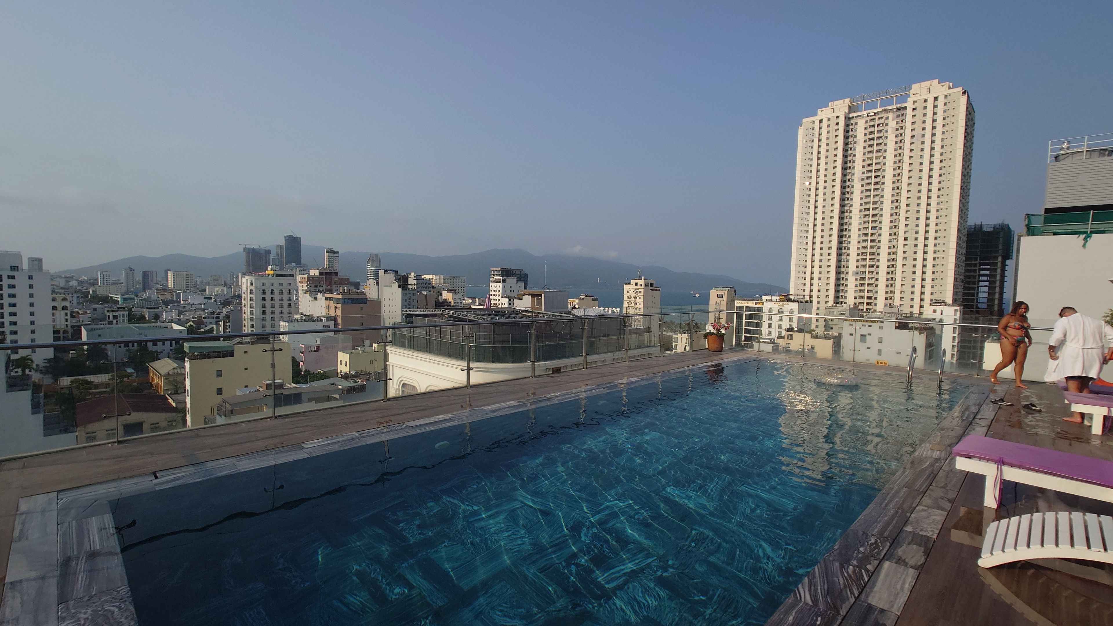 Rooftop infinity pool overlooking Da Nang cityscape