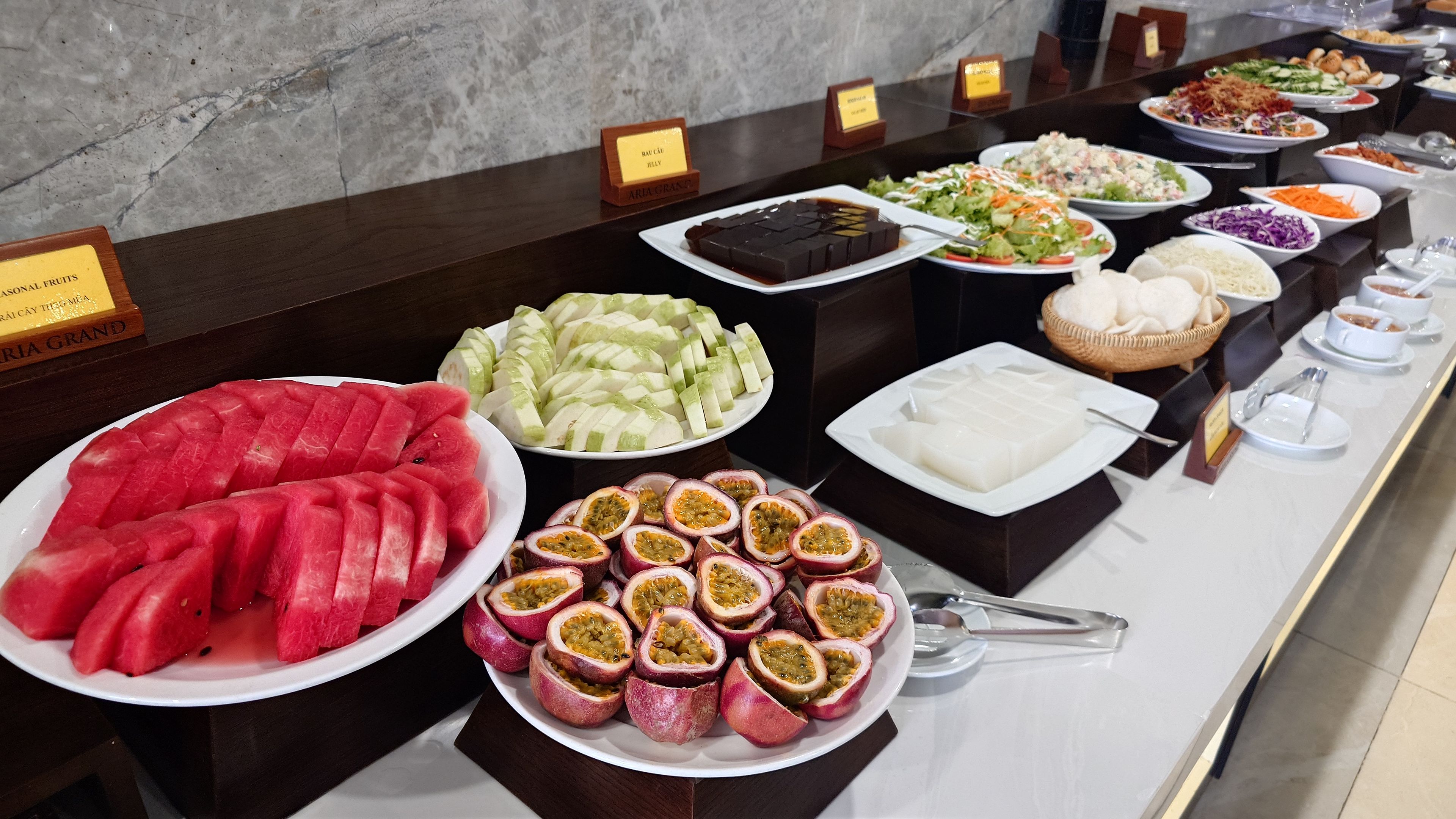 Breakfast buffet featuring fresh fruits and various dishes