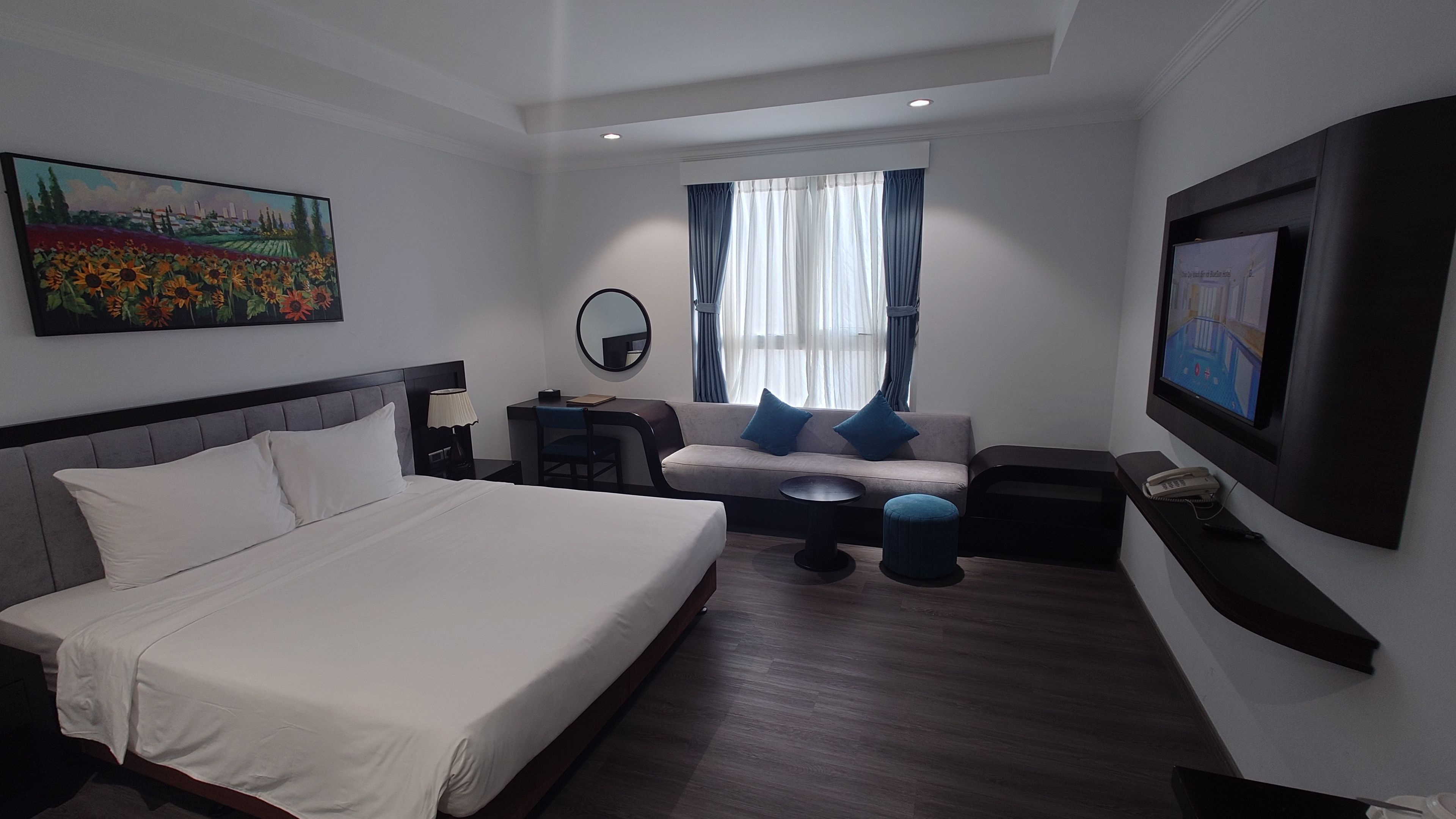 Spacious modern guest room with a sofa area