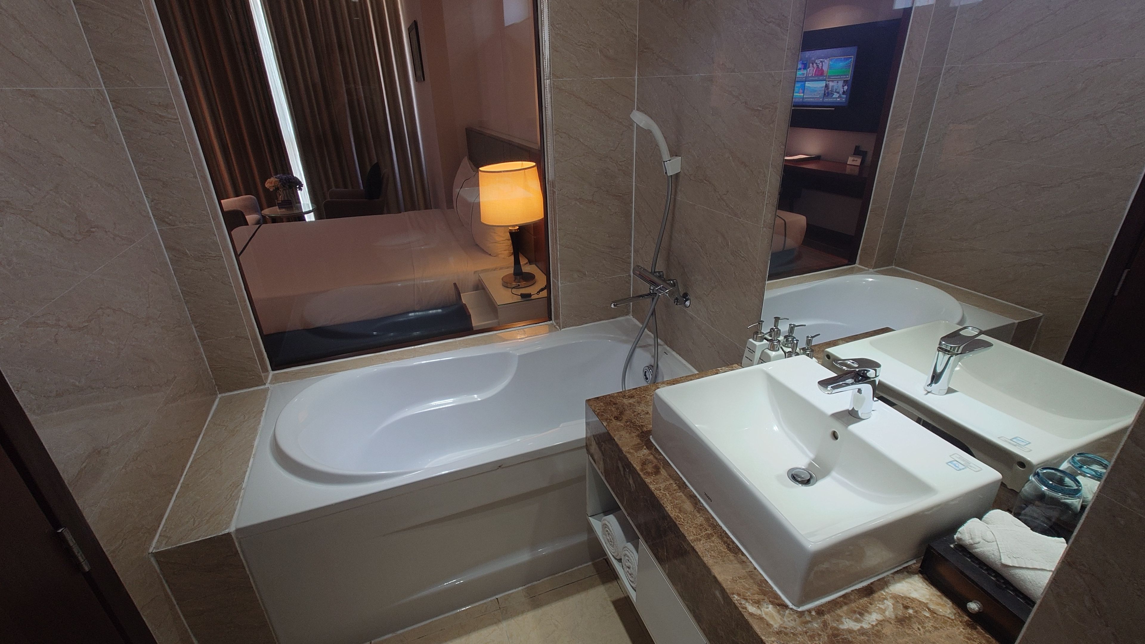 Clean bathroom equipped with a tub and shower