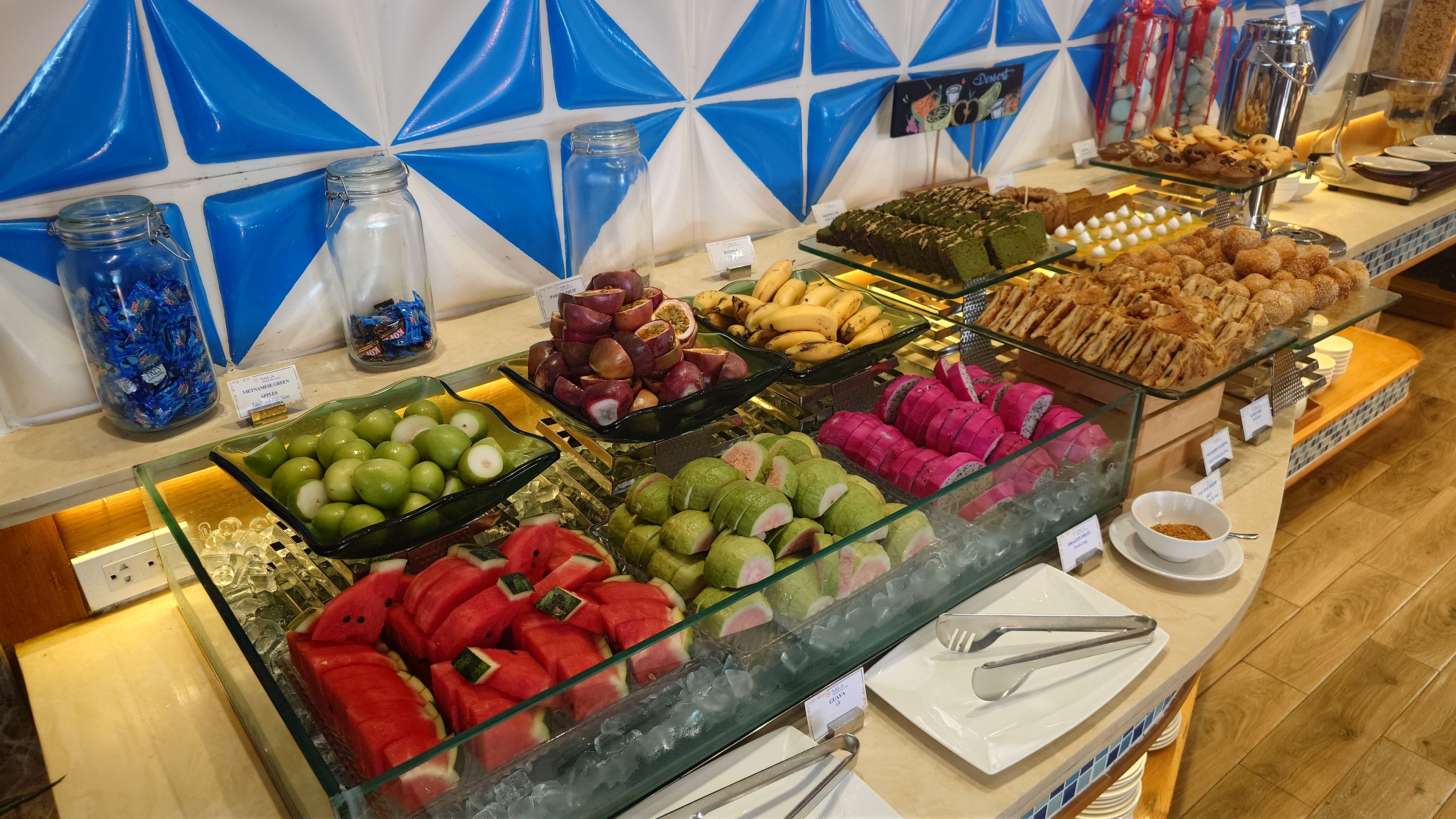 Breakfast buffet fruits and cakes